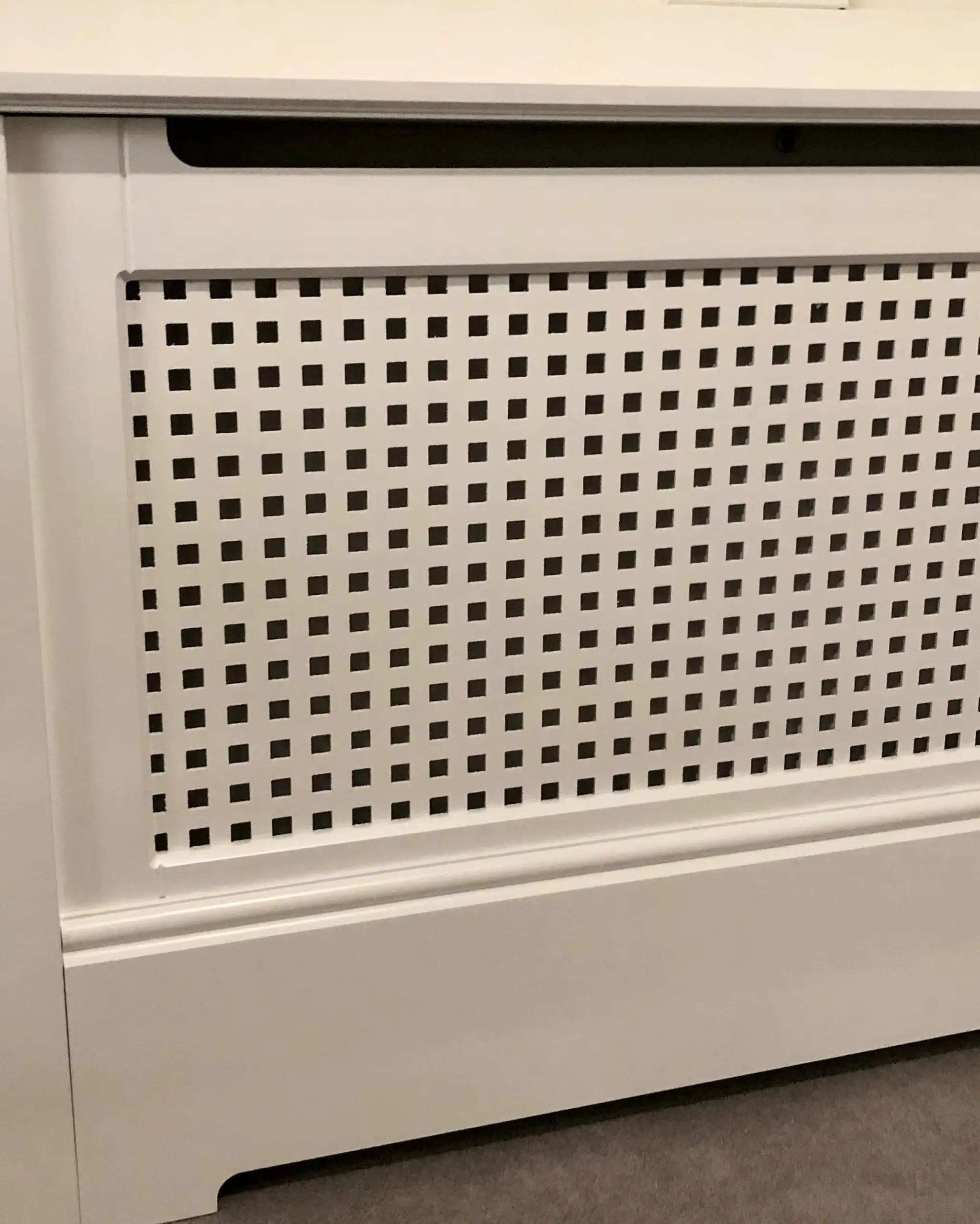 Square-hole-grille_in-radiator-cabinet