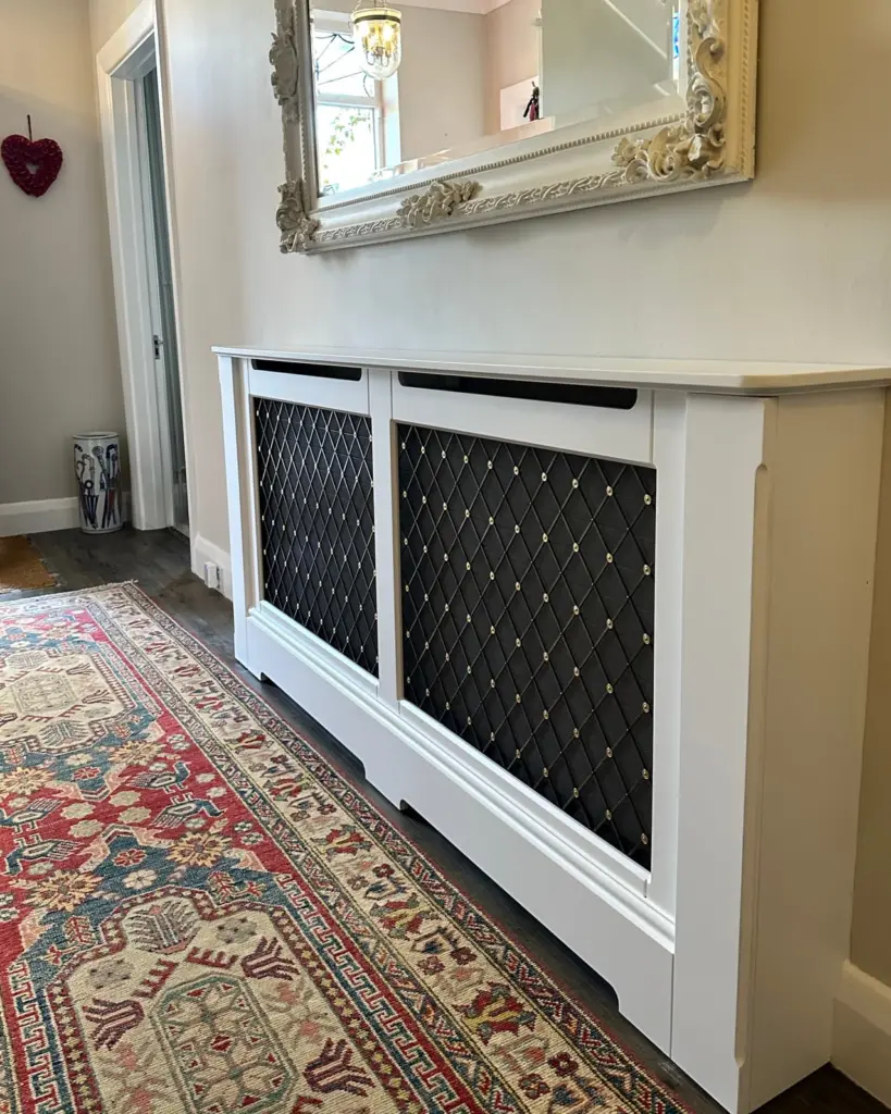 Luxury/Antique Brass standing Radiator cabinet in traditional home with decorative rug