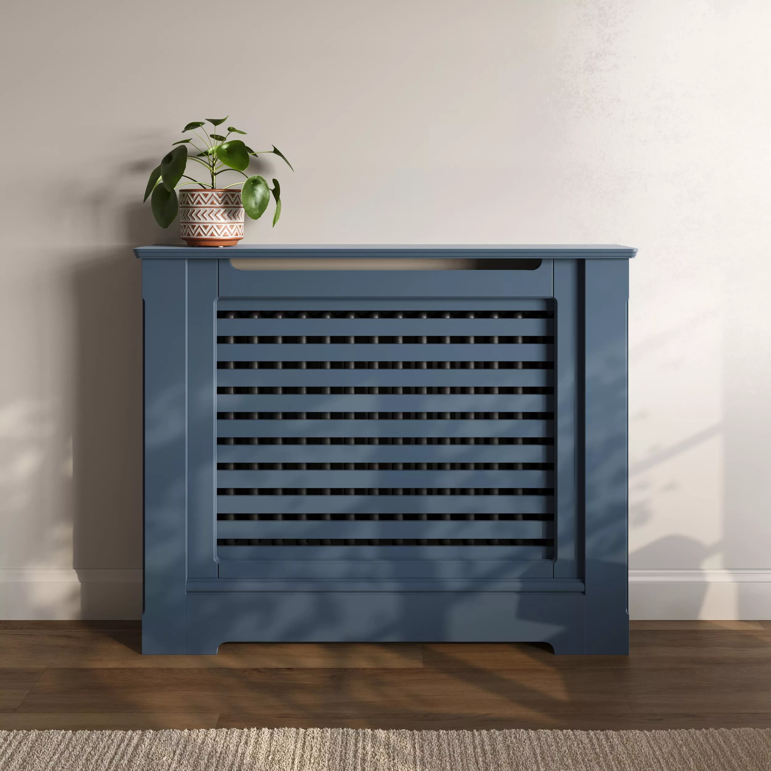 -https://radiatorcabinetsuk.co.uk/wp-content/uploads/2026/01/radiator-cabinet_traditional_horizontal-slats_standing_luxury_FB-Stiffkey-Blue_standard-top.webp