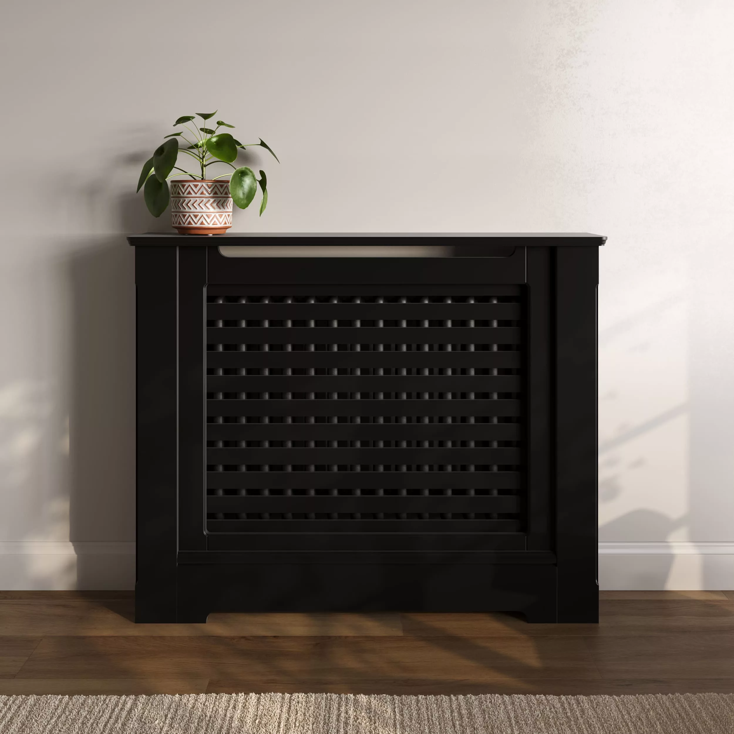 -https://radiatorcabinetsuk.co.uk/wp-content/uploads/2026/01/radiator-cabinet_traditional_horizontal-slats_standing_luxury_black_standard-top.webp
